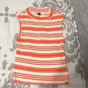 Orange and white striped crop top.